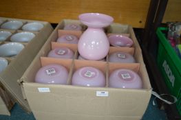 Twelve Pink Glass Vases