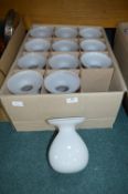 Twelve White Glass Vases