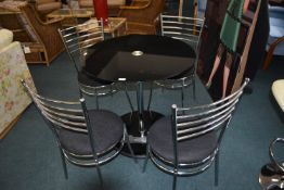 Black Glass Circular Table with Four Chrome Dining