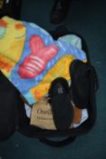 Black Travel Case Containing Towels and Shoes