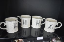 *Contents of Shelf to include Four Mugs (2 with K, 2 with H)