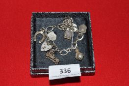 Sterling Silver Charm Bracelet and Lock with Continental Silver Charms