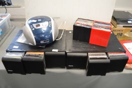 Two CD Storage Units and Contents plus Portable CD Player