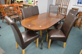 Oval Dining Table with Six Brown Faux Leather Chairs