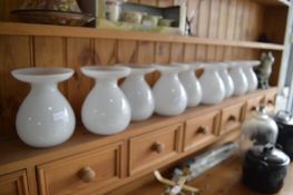 Nine White Glass Vases