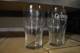 Contents of Shelf Including an Assortment of Pint Glasses