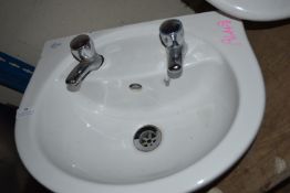White Ceramic Basin with Taps