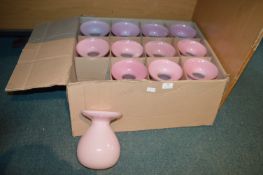 Twelve Pink Glass Vases