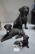 Three Black Labrador Figures
