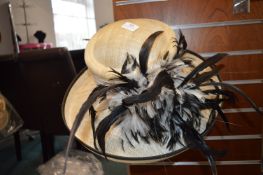 *Lady’s Wide Brimmed Natural Hat with Black Rim & Feather Decoration