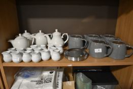 Contents of Shelf to Include Assorted Teapots and Cream Pitchers