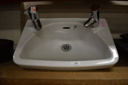 White Ceramic basin with Taps