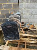 Five Ford Model T radiators with parts, various conditions.