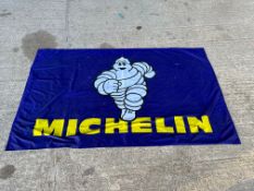 A Michelin Mr. Bibendum nylon banner/tablecloth, 75 x 45