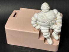 A 1950s Michellin Bibendum 'Baby Girl' moneybox, 5 1/4