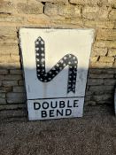 A Double Bend metal road sign with raised S-Bend and 43 reflectors, 28 x 42