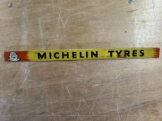 A Michelin Tyres tin shelf strip with image of Mr. Bibendum to left hand side, 18 1/2 x 1 1/4