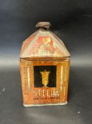 A Stella Sanctuary Lamp Oil pyramid can.