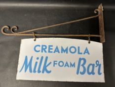 A Creamola Milk Foam Bar double sided enamel sign hanging from a wall bracket, 30 x 21