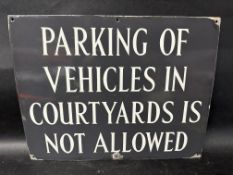 A 'Parking of Vehicles in Courtyards is Not Allowed' enamel sign, 18 x 14