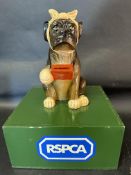 An RSPCA charity donation box with a dog dog to top, 12