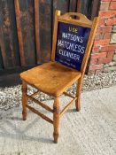 An enamel backed chair advertising Watson's Matchless Cleanser to front and Sparkla Soap to rear, by