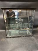 A Fry's Choice Chocolates glass display cabinet, sliding doors to rear, two glass shelves, 27 1/2