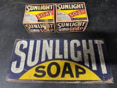 A Sunlight Soap tin sign, 10 x 4 1/2