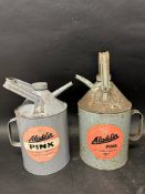 Two Aladdin pink paraffin filler cans.
