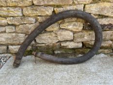A Fire pump hose - leather and copper riveted with approx. 30mm internal diameter bronze male and