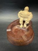 A Michelin Mr. Bibendum bakelite ashtray .