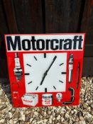 A Motorcraft acrylic wall clock with illustrations advertising the brand's products, 15 x 15 3/4