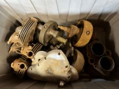 A box of Triumph spares including heads, barrels, cranks etc.