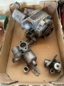 A Shorrock Super Charger and an SU carburettor.