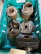 A box of cylinders and a barrel.