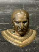 A bronze mascot in the form of a native American.