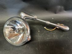 A hand-controlled driving lamp in very good condition.