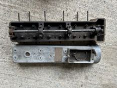 An AC cylinder head and cam cover.