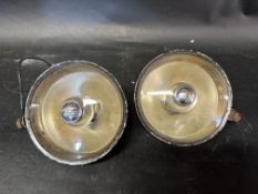 Two 1950s Miller spotlights.
