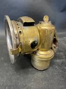 A Joseph Lucas Calcia Club brass acetyphote lamp model 143.