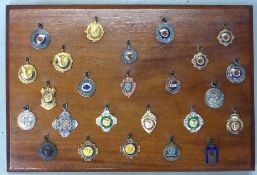 A collection of competition medals, most dating from the 1920s/30s. One set displayed in a hinged