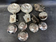 Two Lucas spotlights, five chrome Ford wheel centres etc.