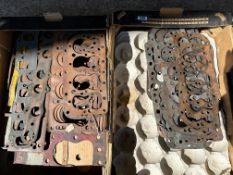 Two boxes of cylinder heads.