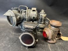 Four lamps: rear paraffin lamp, Lucas Model 143 carbide lamp, H. Miller & Co. 'Lumo' rear lamp and a