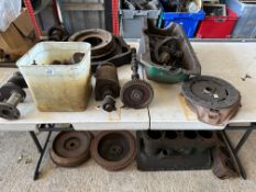 A good selection of Ford Model A spares inc. a crankshaft, shock absorbers, starter motor, bell
