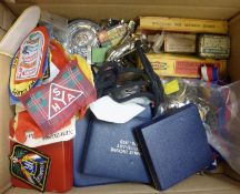 A box of assorted ephemera inc boxed medallions, entrants medals, cloth badges, lapel badges,