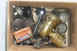 A box of bicycle bells and bicycle lighting.