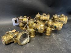 Six brass lamps: A Lucas Kora 262, 2 x P&H Chieftain, Lucas Calcia 318, Lucas Calia Major 157 and