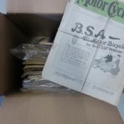 A box of assorted cycling magazines from various periods.