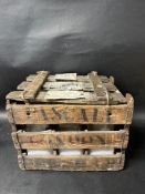 A wooden crate containing six glass Pascall shop dispensing jars.
